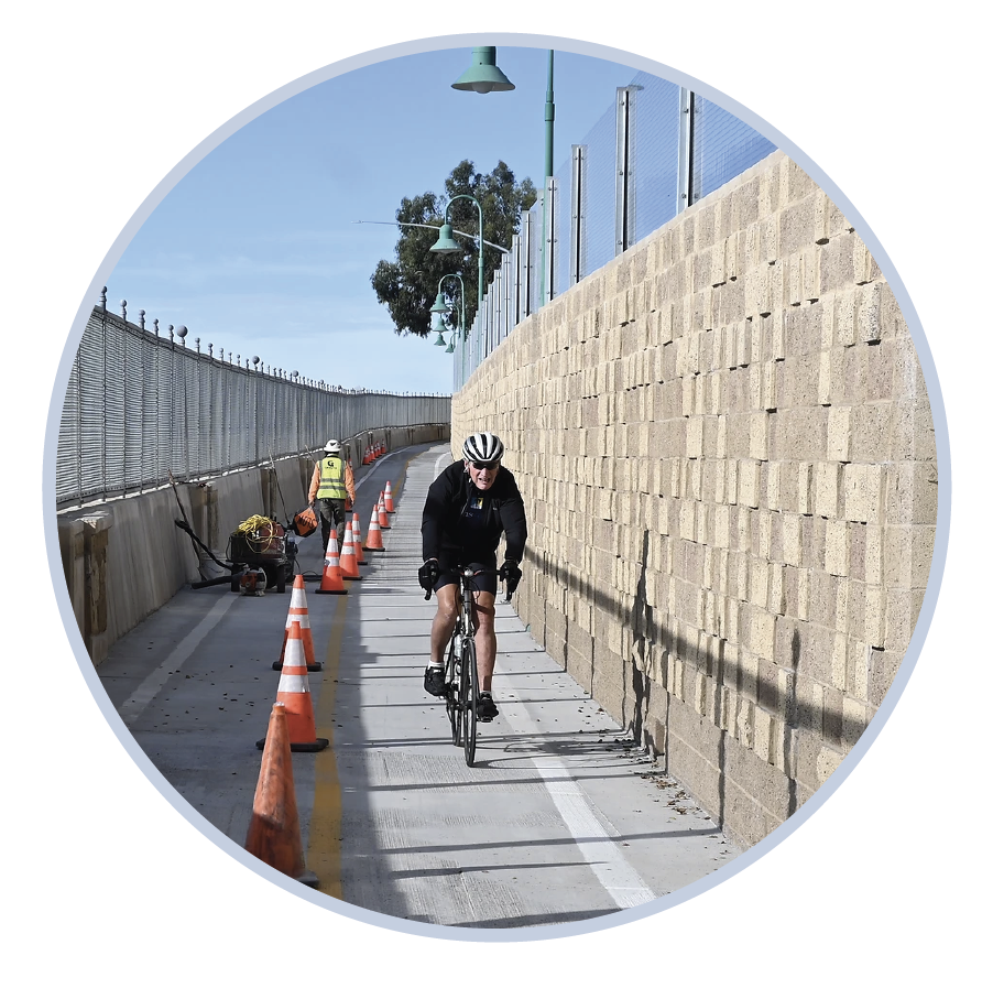 Biker next to the Summerland sound wall